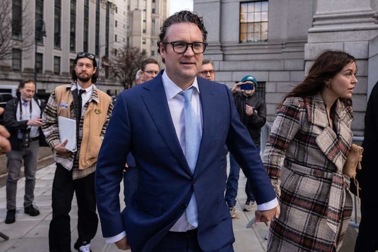 Nikola founder Trevor Milton happily walks ouside