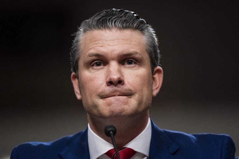 Pete Hegseth furrows his lips during his Senate confirmation hearing