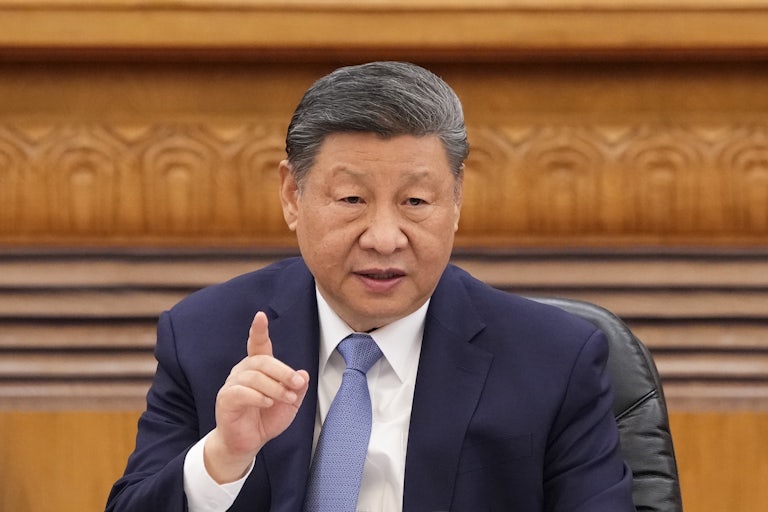 Chinese President Xi Jinping speaks while pointing a finger.