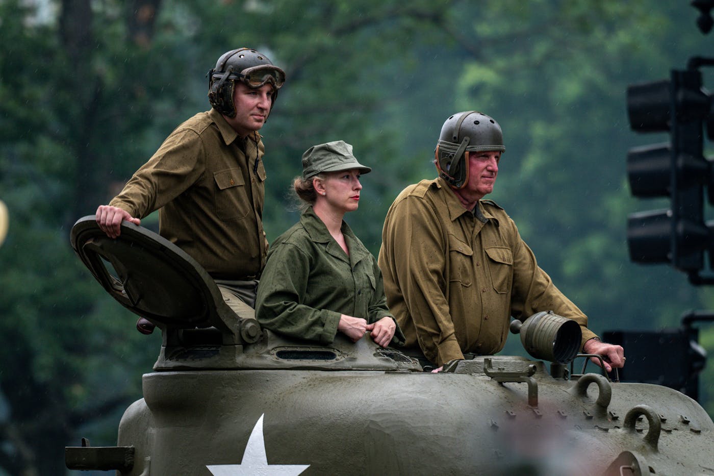 Participants atop a World War II–era tank greeted parade-goers along Constitution Avenue during the U.S. Army’s 250th birthday celebration.