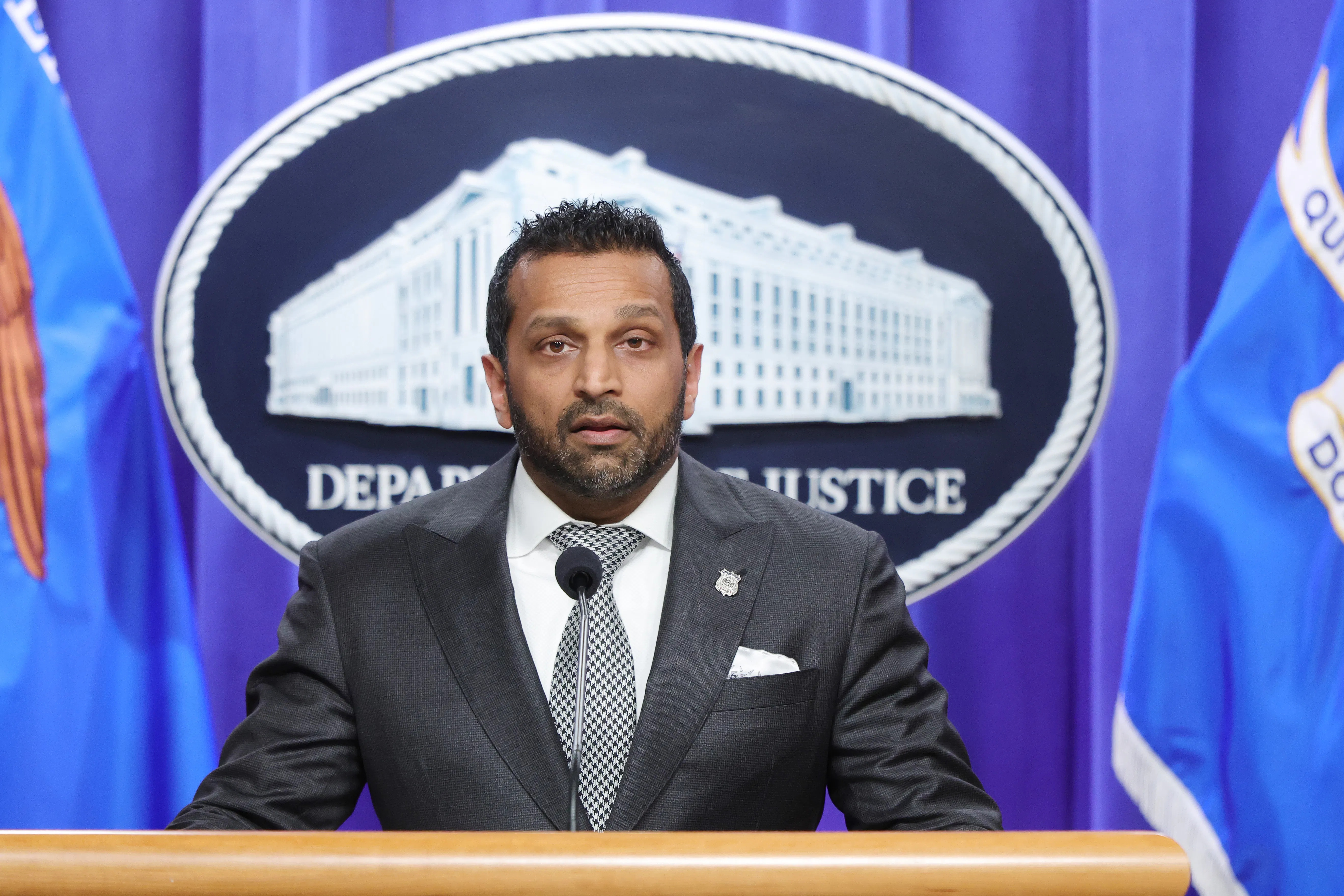 FBI Director Kash Patel speaks at a podium