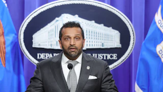 FBI Director Kash Patel speaks at a podium