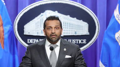 FBI Director Kash Patel speaks at a podium