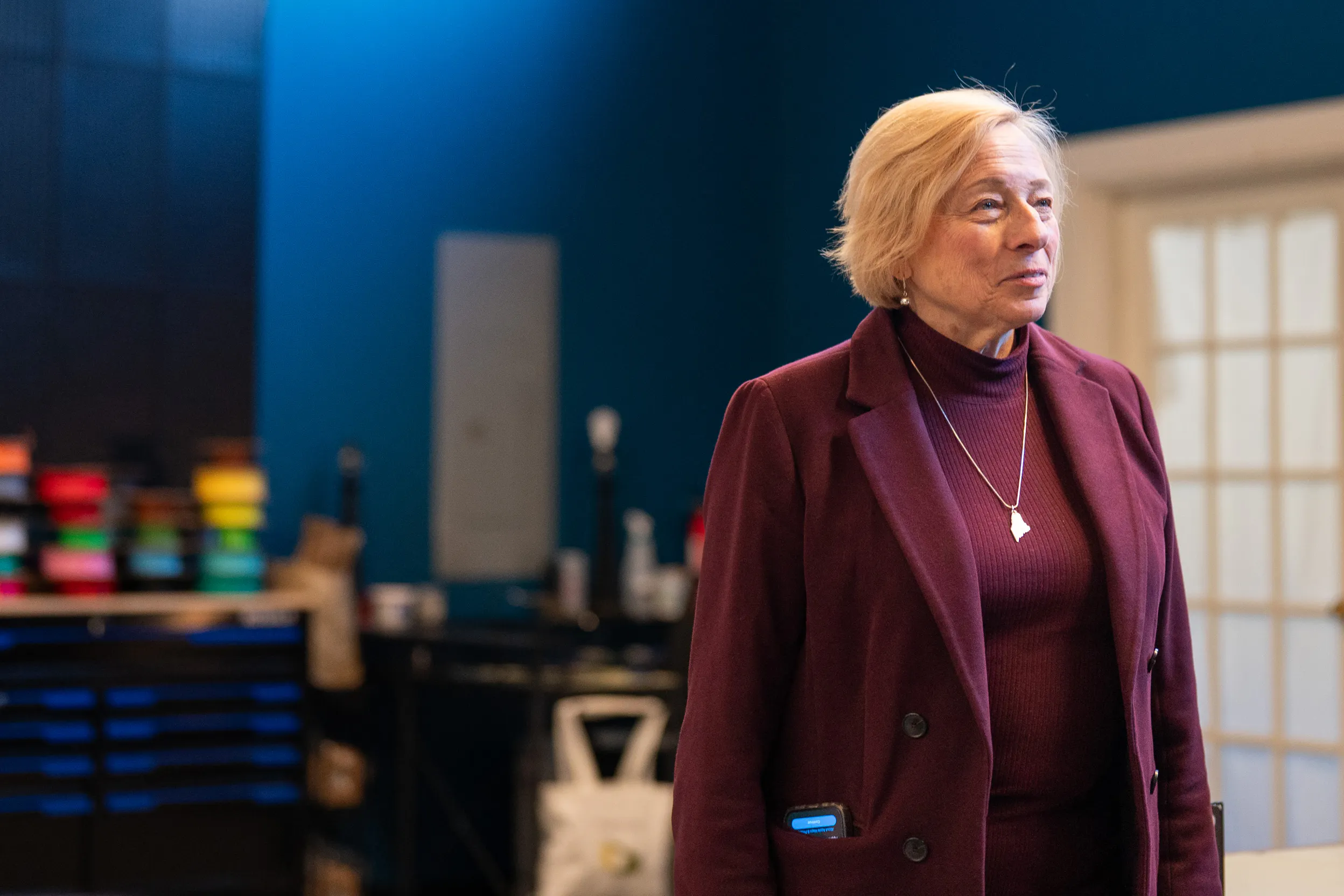  stands in partial profile to the camera during a campaign event