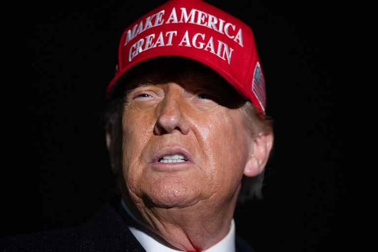 Donald Trump wears a Make America Great Again hat