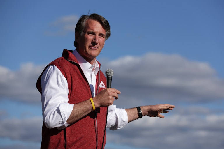 Virginia Governor Glenn Youngkin speaks with a mic in his hand