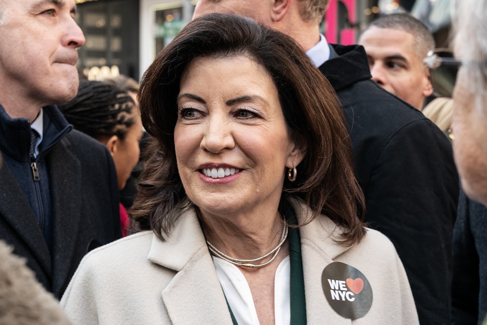 Kathy Hochul stands in a crowd.