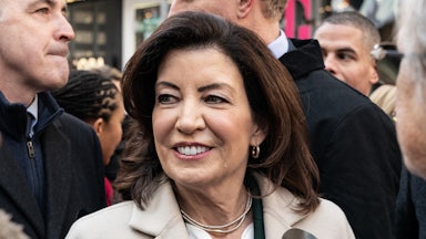 Kathy Hochul stands in a crowd.