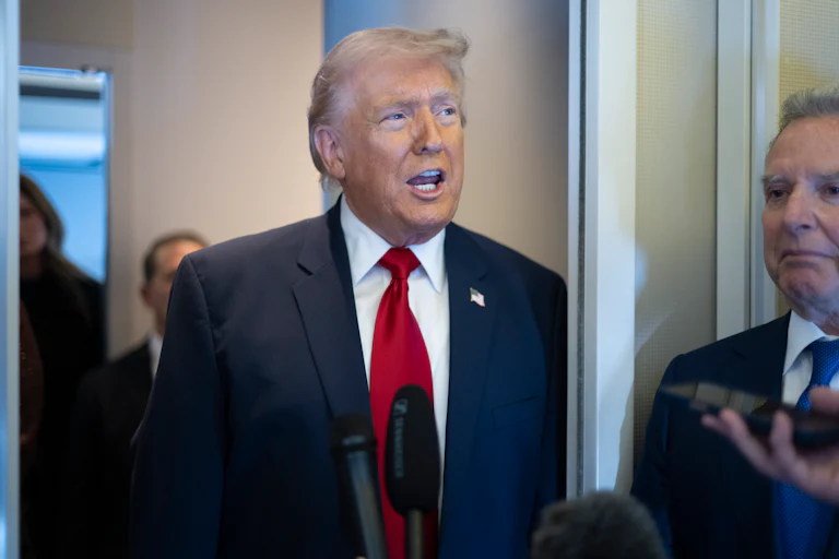 President Donald Trump speaks aboard Air Force One with Steve Witkoff at his side