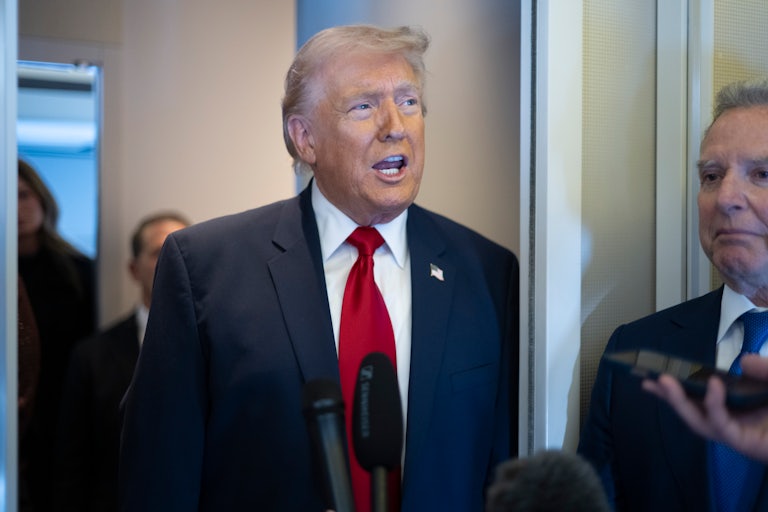 President Donald Trump speaks aboard Air Force One with Steve Witkoff at his side
