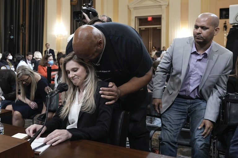 U.S. Capitol Police Officer Harry Dunn hugs his colleague Caroline Edwards, after she testified at the January 6 Committee's Thursday night hearing.