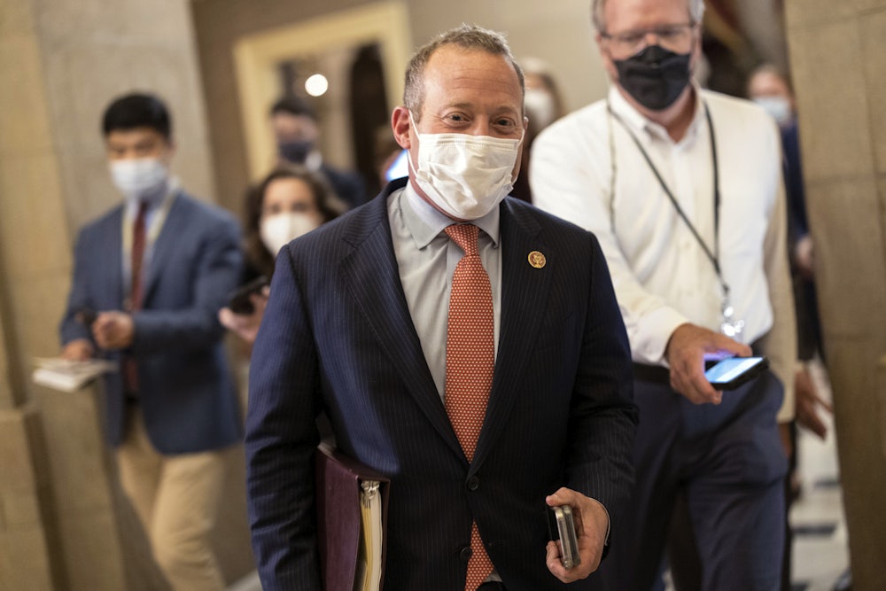 A masked Josh Gottheimer makes his way to Nancy Pelosi’s Capitol Hill office.
