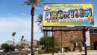 A billboard reads, “Welcome to California where abortion is safe and still legal” on July 12 in Rancho Mirage, California.
