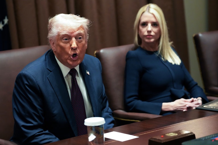 Donald Trump and Pam Bondi sit in a Cabinet meeting.