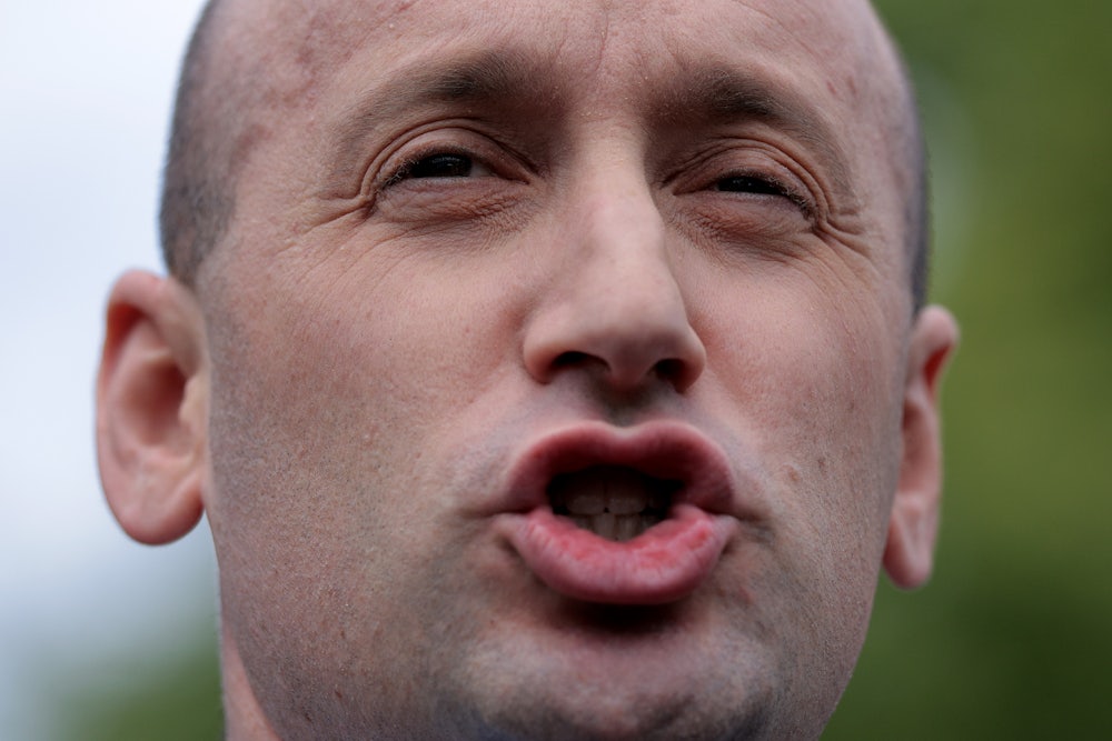 Stephen Miller speaks to reporters outside the White House