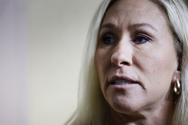 Marjorie Taylor Greene looks to the side