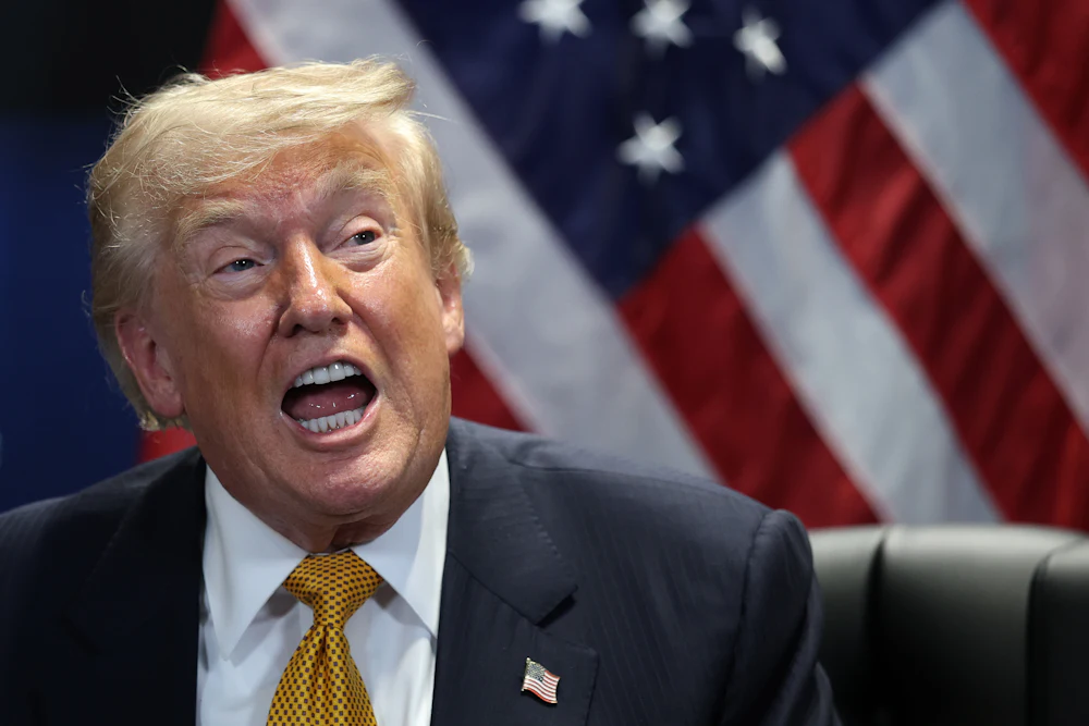 Donald Trump speaks vehementy with wide-open mouth