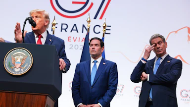 Secretary of State Marco Rubio and Treasury Secretary Scott Bessent look on as President Donald Trump speaks at the G7 summit