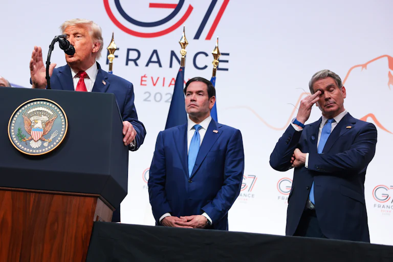 Secretary of State Marco Rubio and Treasury Secretary Scott Bessent look on as President Donald Trump speaks at the G7 summit