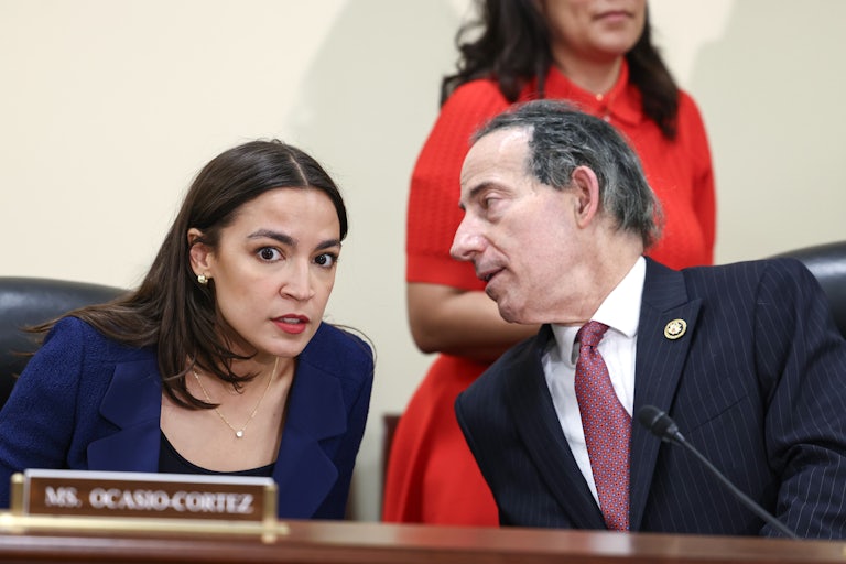 Alexandria Ocasio-Cortez and Jamie Raskin speak to each other