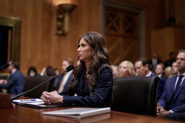Kristi Noem sits at a table during her Senate confirmation hearing