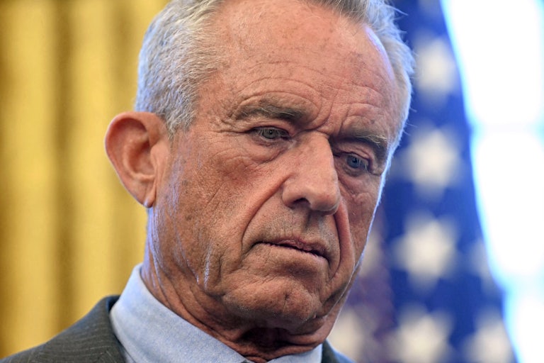 Robert F. Kennedy Jr. looks down while standing in the Oval Office