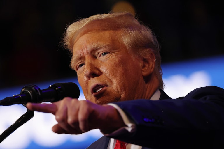 Donald Trump speaks and points