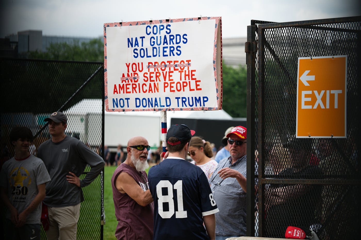 A protester argues with pro-Trump supporters outside the security entrance to the National Mall in Washington, D.C.,