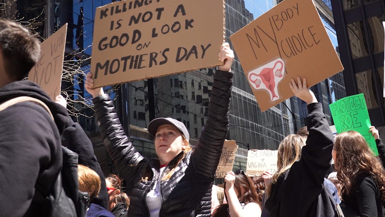 Abortion rights demonstrators rally before marching through downtown Chicago.