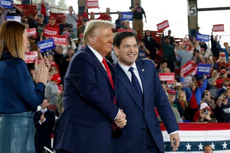 Donald Trump shakes hands with Marco Rubio at a Trump rally