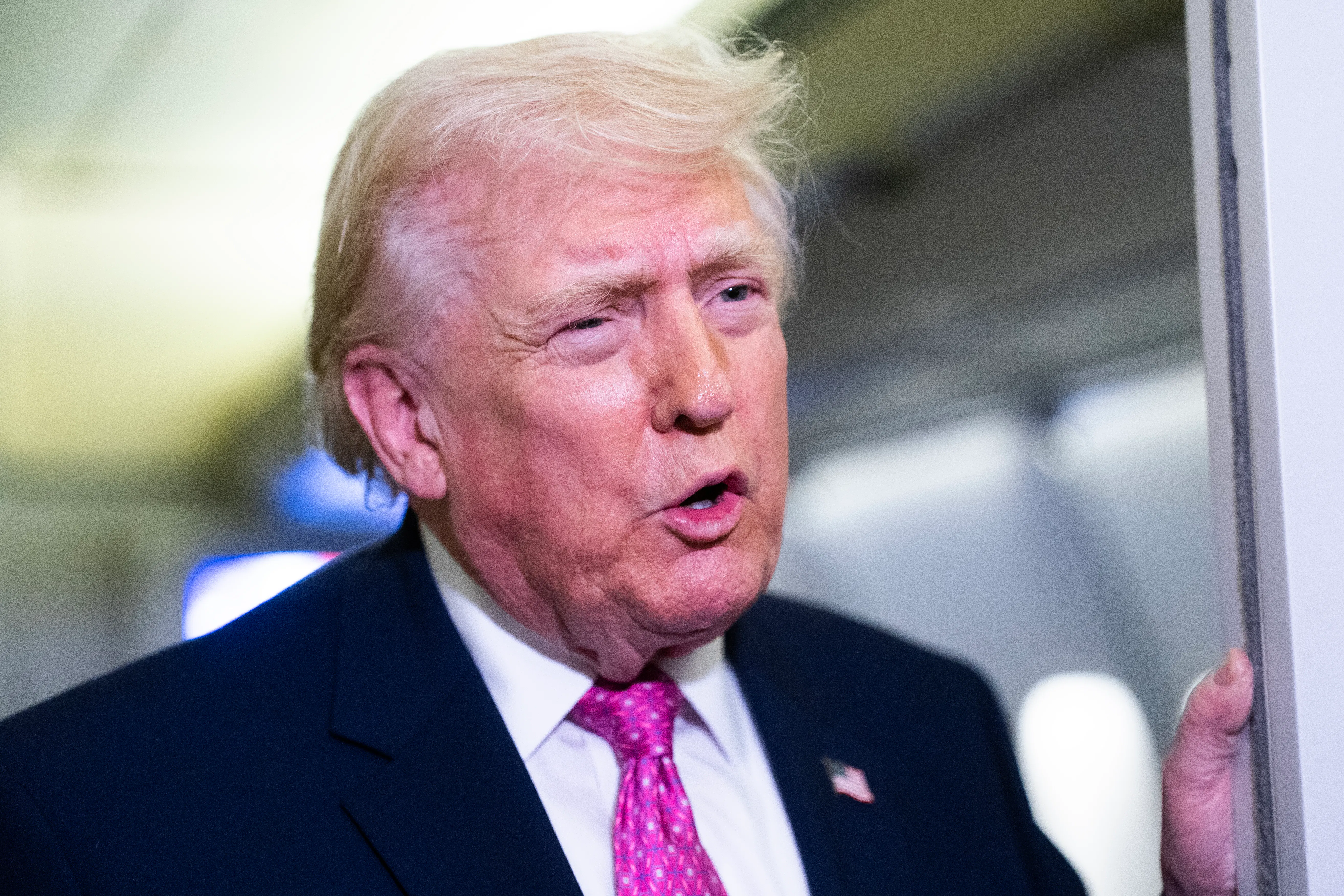 President Donald Trump speaking aboard Air Force One.