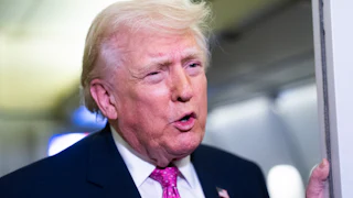 President Donald Trump speaking aboard Air Force One.