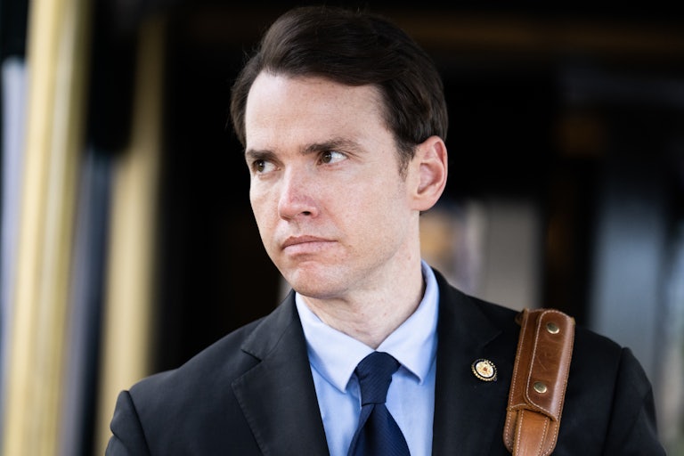 Representative Kevin Kiley looks to the side while walking