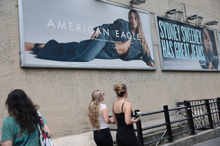 Billboards of actress Sydney Sweeney’s American Eagles ad. One shows her lying on her side wearing jeans and a jean jacket, with nothing underneath. Another shows her wearing jeans with the caption "Sydney Sweeney has great jeans."