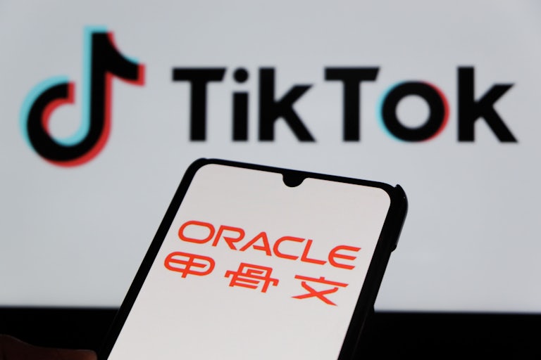Oracle logo is displayed on a smartphone in front of a TikTok background