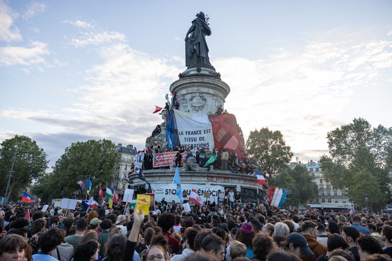 People celebrate the far-right’s loss in Paris, France