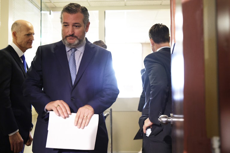 Ted Cruz steps off an elevator as he arrives at a news conference at the U.S. Capitol.