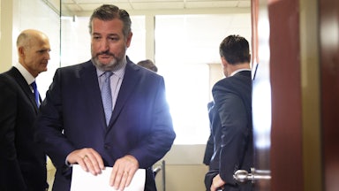 Ted Cruz steps off an elevator as he arrives at a news conference at the U.S. Capitol.