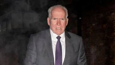 Former CIA Director John Brennan walks