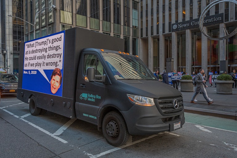 A billboard truck with Tucker Carlson's head and a quote that reads "What [Trump's] good at is destroying things. He could easily destroy us if we play it wrong." Nov. 5, 2020