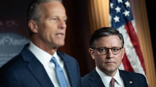 House Speaker Mike Johnson looks at Senate Majority Leader John Thune, who speaks