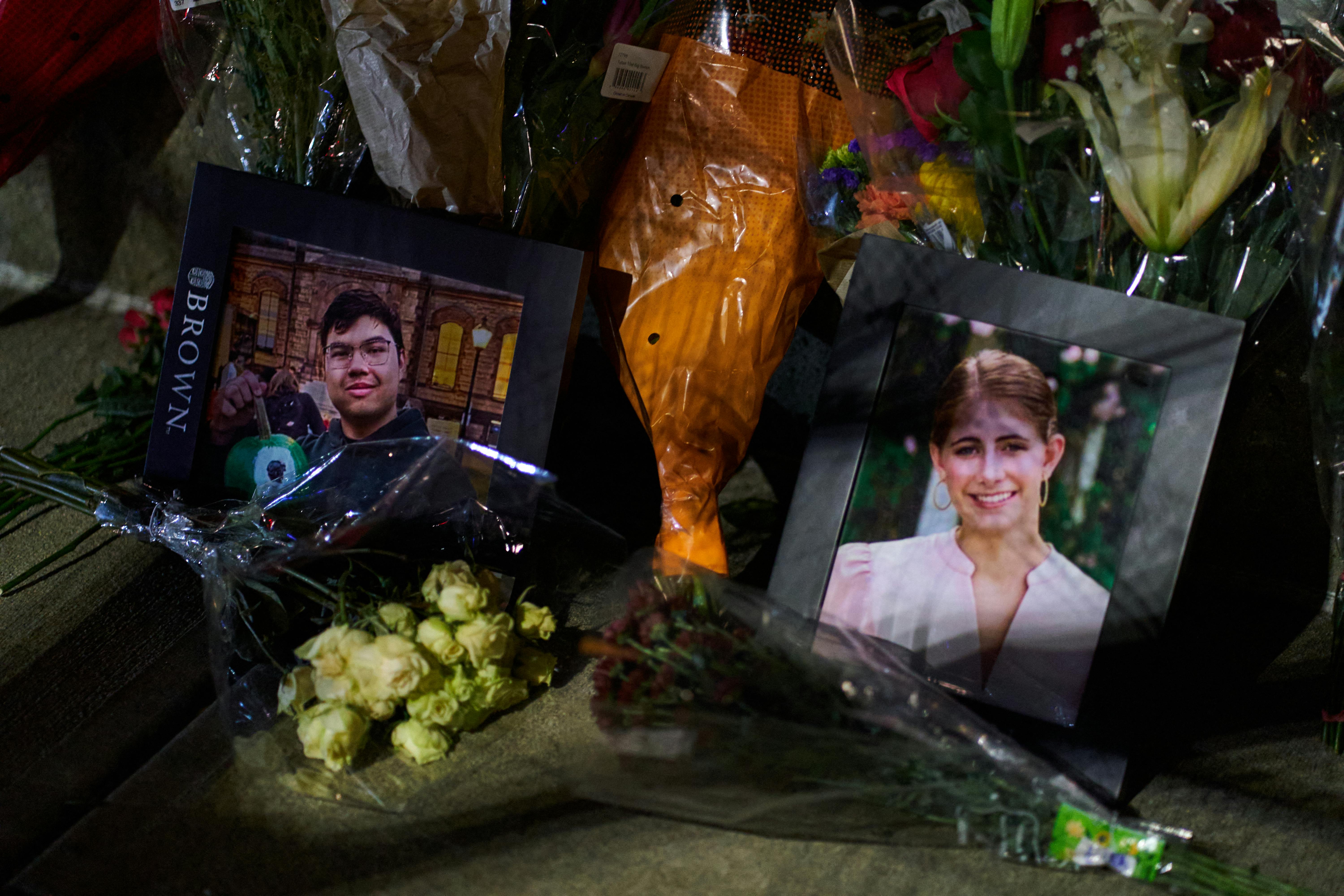 Framed photos of shooting victims Mukhammad Aziz Amurzokov and Ella Cook at a makeshift memorial 