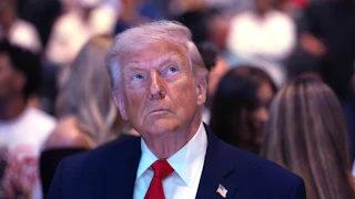 Donald Trump looks upward with an irritable expression