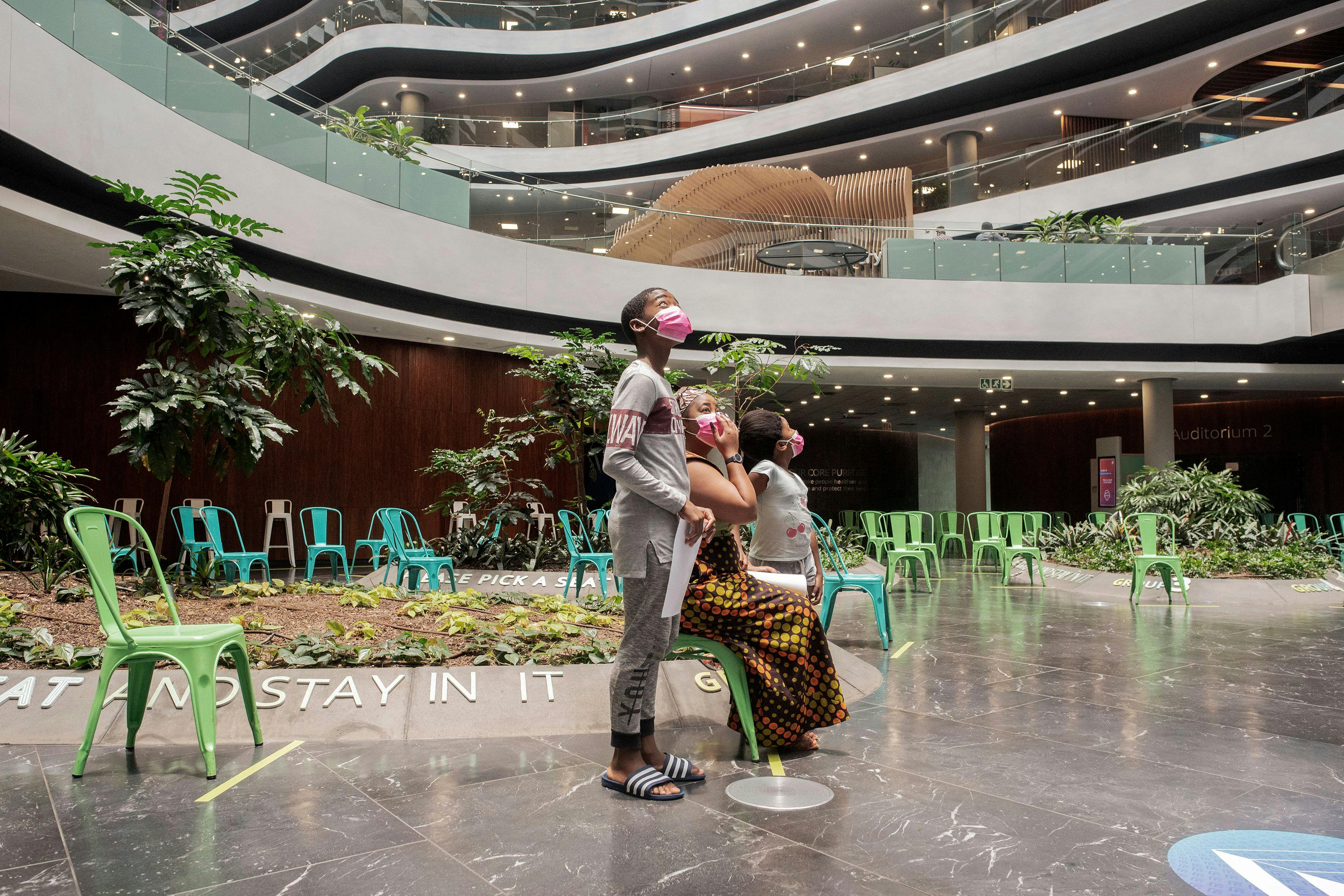 A family at the Discovery vaccination site in Johannesburg