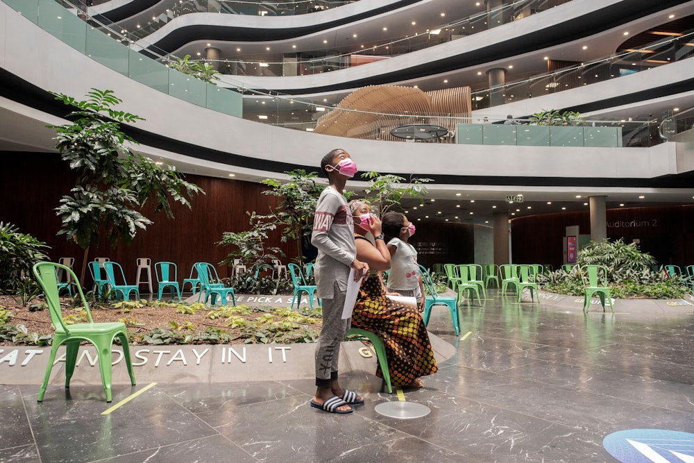 A family at the Discovery vaccination site in Johannesburg
