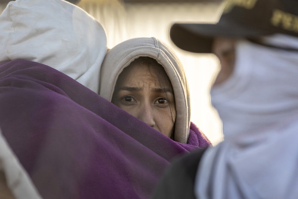 An immigrant looks into the camera.