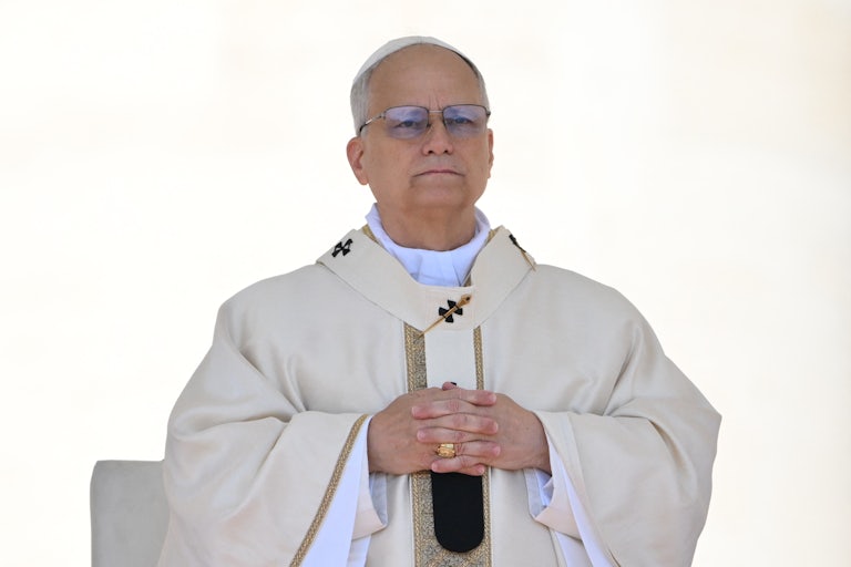 Pope Leo crosses his hands across his chest.