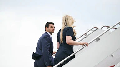 Tiffany Trump and her husband Michael Boulos board a plane