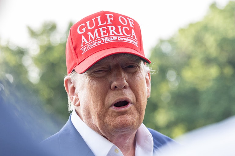 Donald Trump speaks to reporters outside the White House