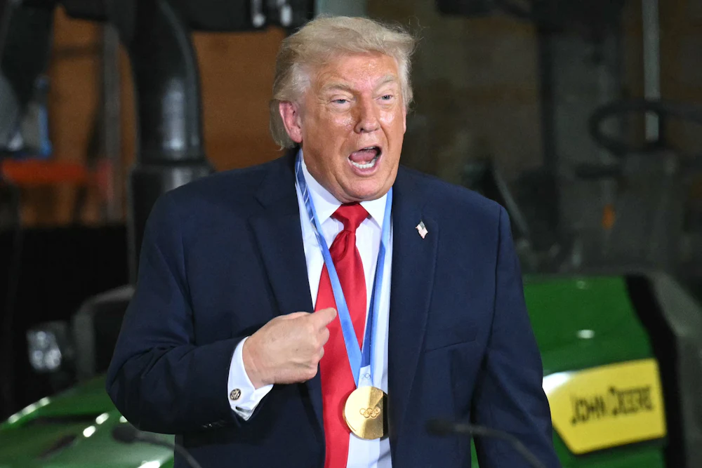 Donald Trump speaks vehemently while wearing a medal